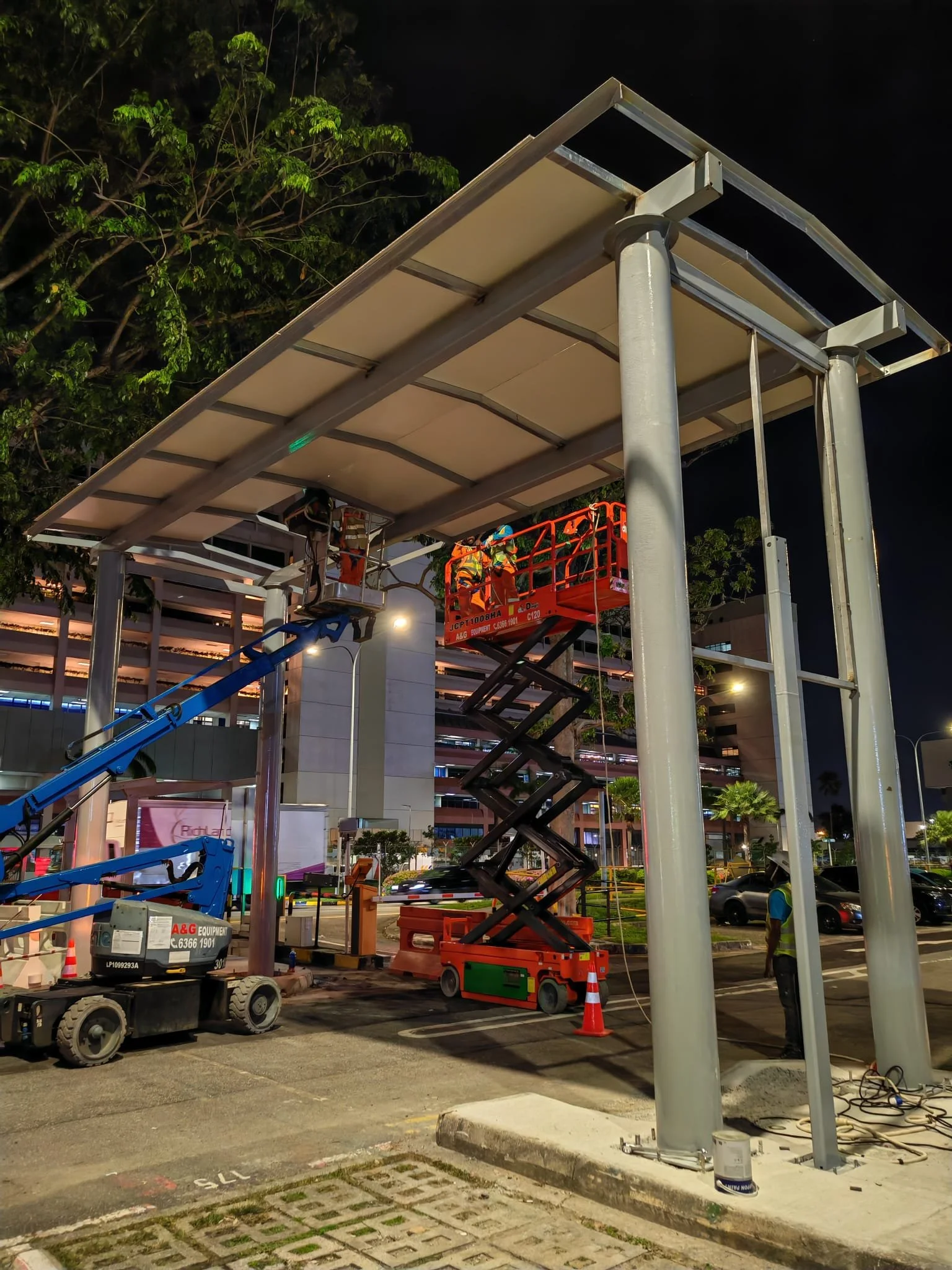 Oranssi technician working on a roof project