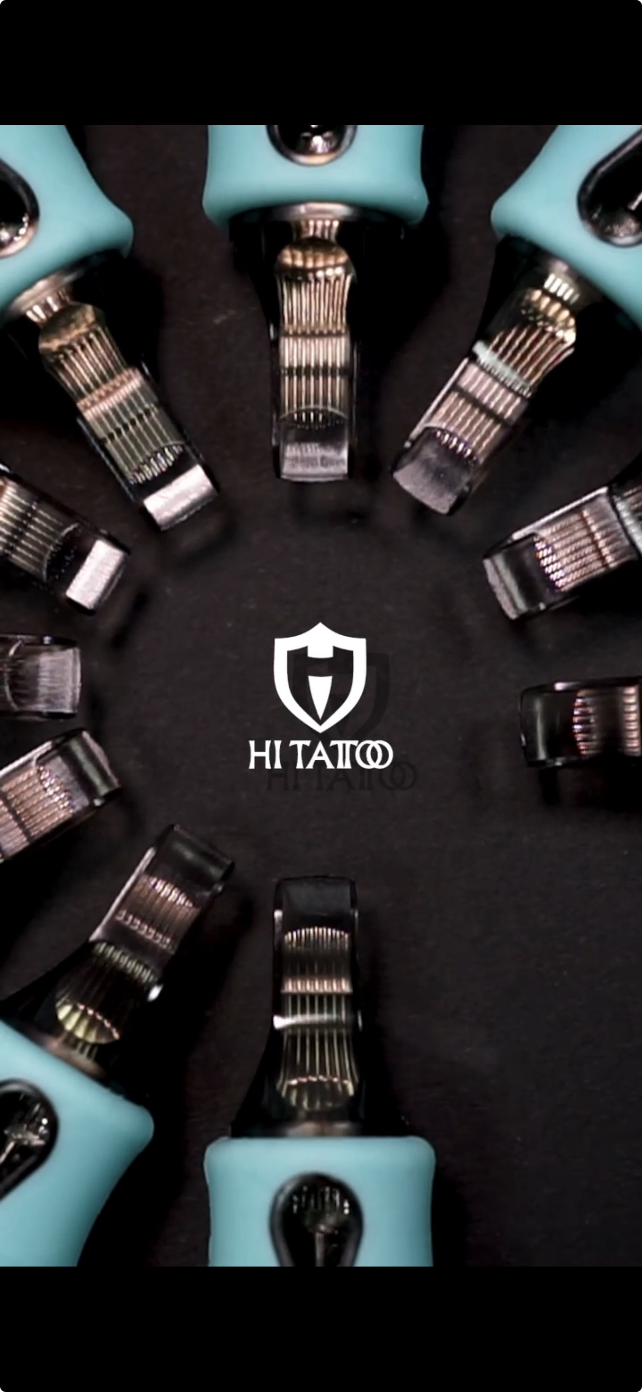 Collection of tattoo machines arranged in a circle on a black surface with 'HI TATTOO' logo in the center.