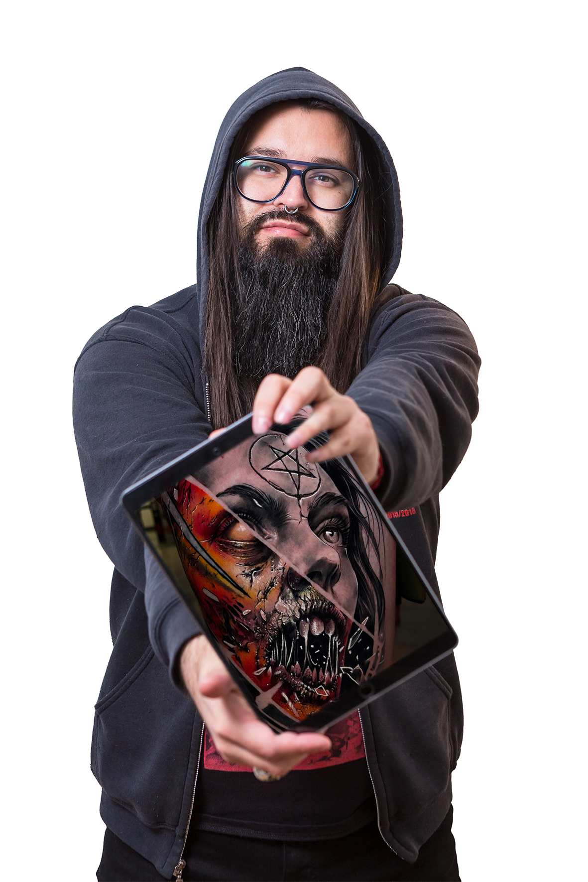 A man with long hair, glasses, and a beard holding a tablet showing a tattooed woman with makeup and piercings