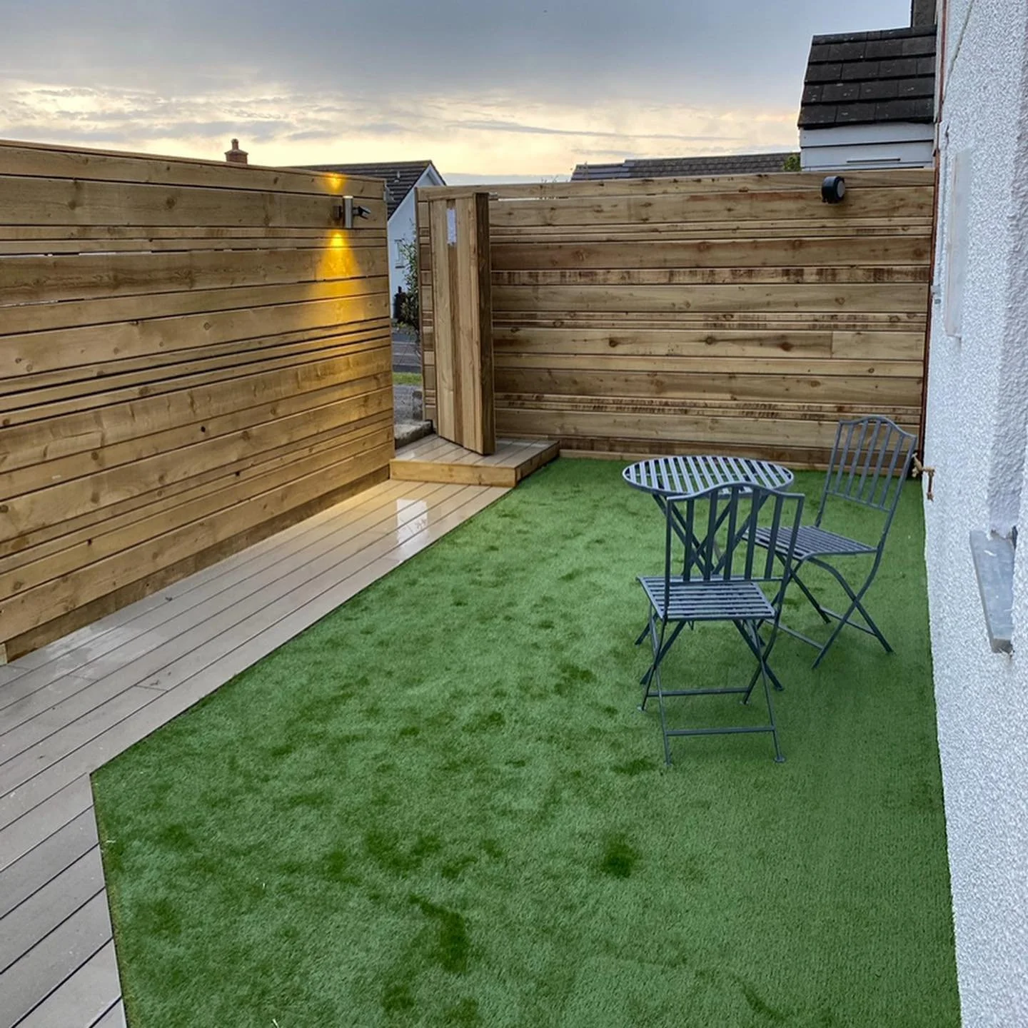 Finishing touches to work on a home in Cornwall includes fencing, decking and astroturf for easy management