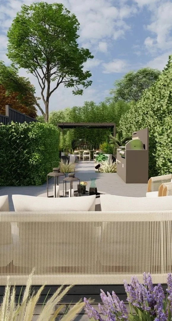 An outdoor patio area with modern furniture, surrounded by lush green bushes and trees under a partly cloudy sky, featuring a barbecue grill and seating arrangements.