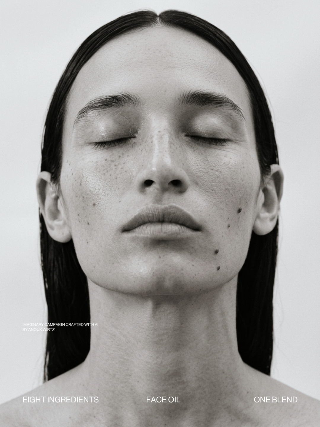 Close-up of a woman with clear complexion, her eyes closed, dark hair, and minimal makeup, in black and white.