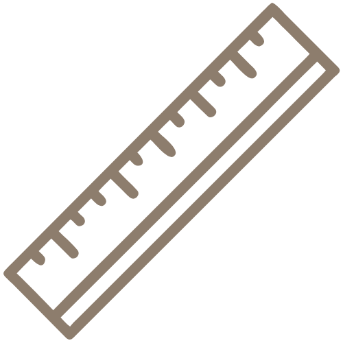 Brown ruler with black markings at an angle.