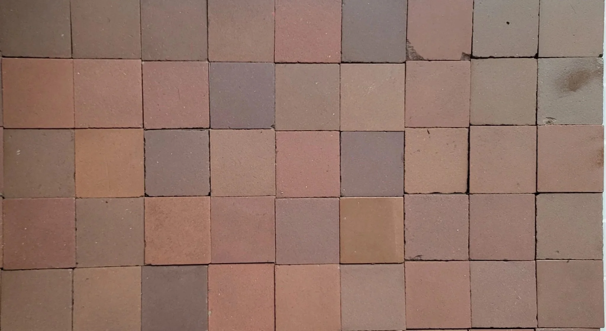 Close-up view of the myriad of shades of brown all found within one tiled floor.