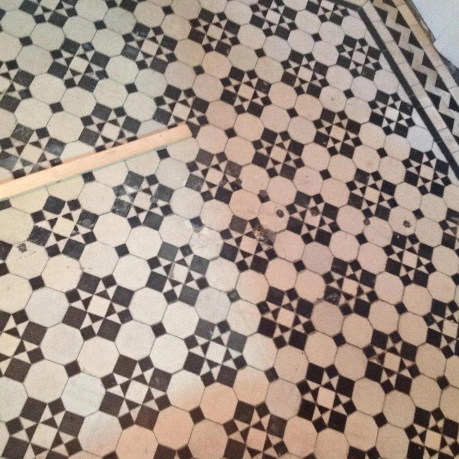 Pretty, intricate Black and white antique hallway tiles
