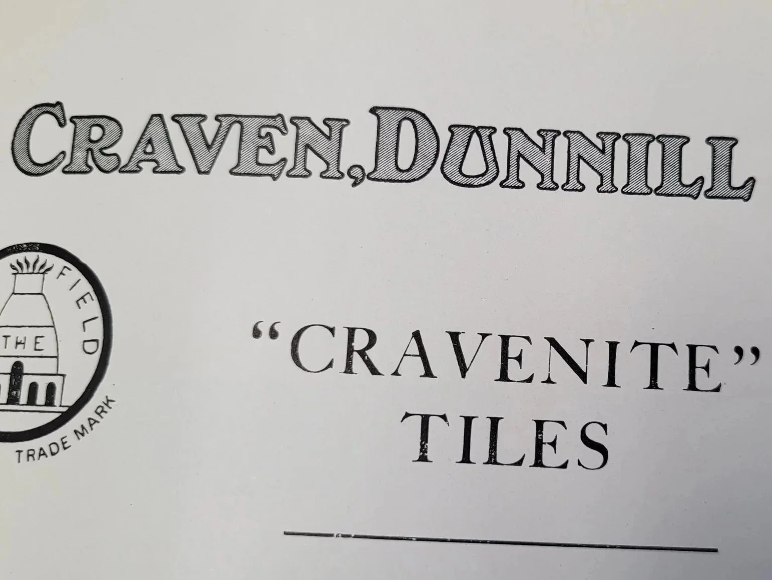 Close-up of packaging for Craven.Dunnill tiles, featuring the brand name and logo.