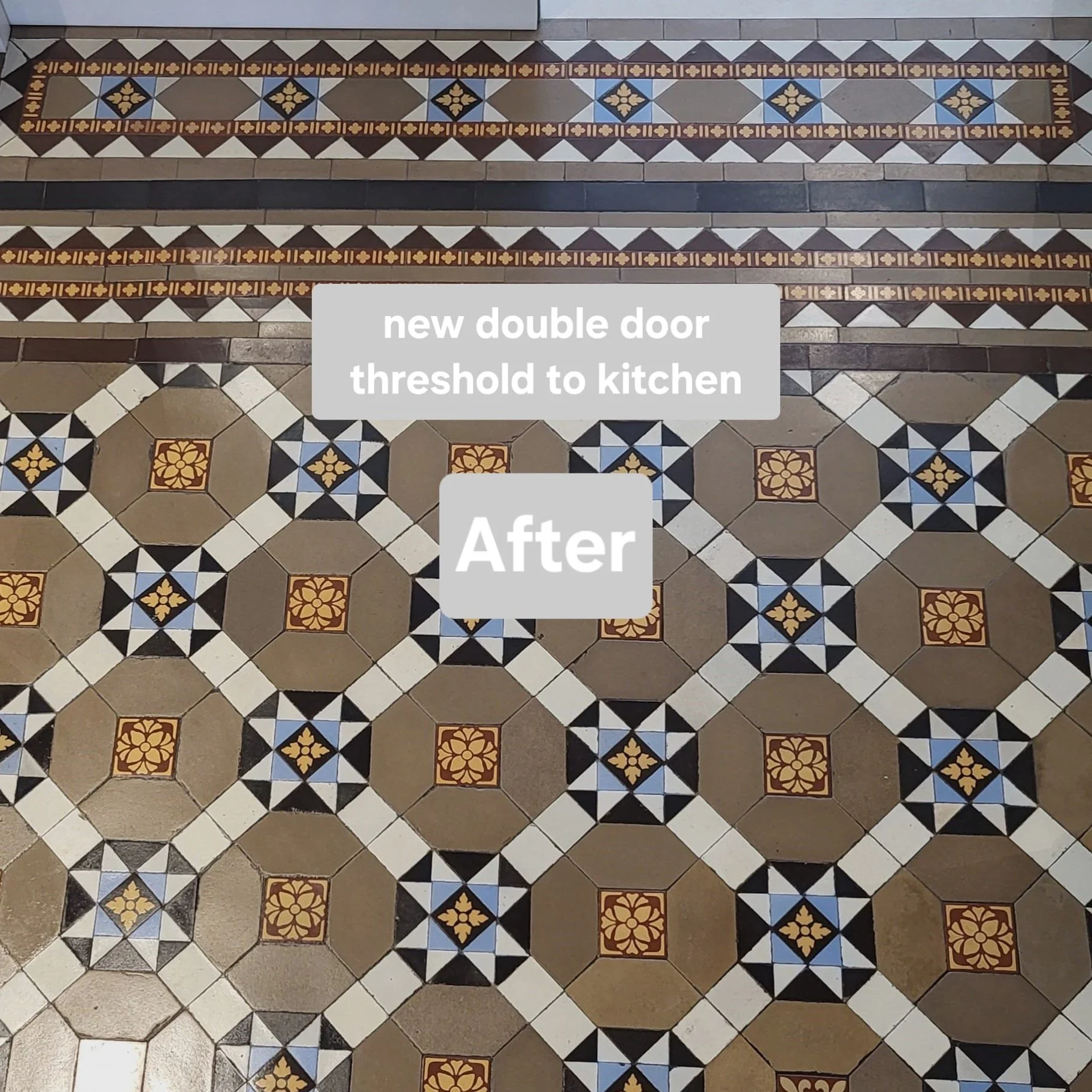 Patterned tile floor with a new double door, outlined with decorative border tiles, leading to the kitchen.