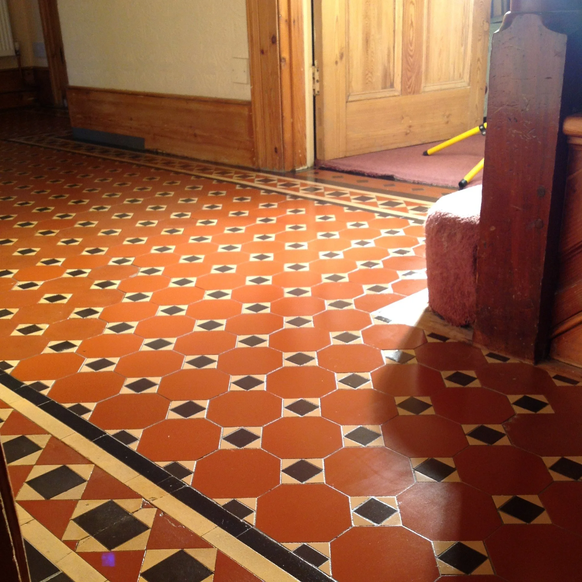 Edwardian geometric hall floor with red octagonal tiles
