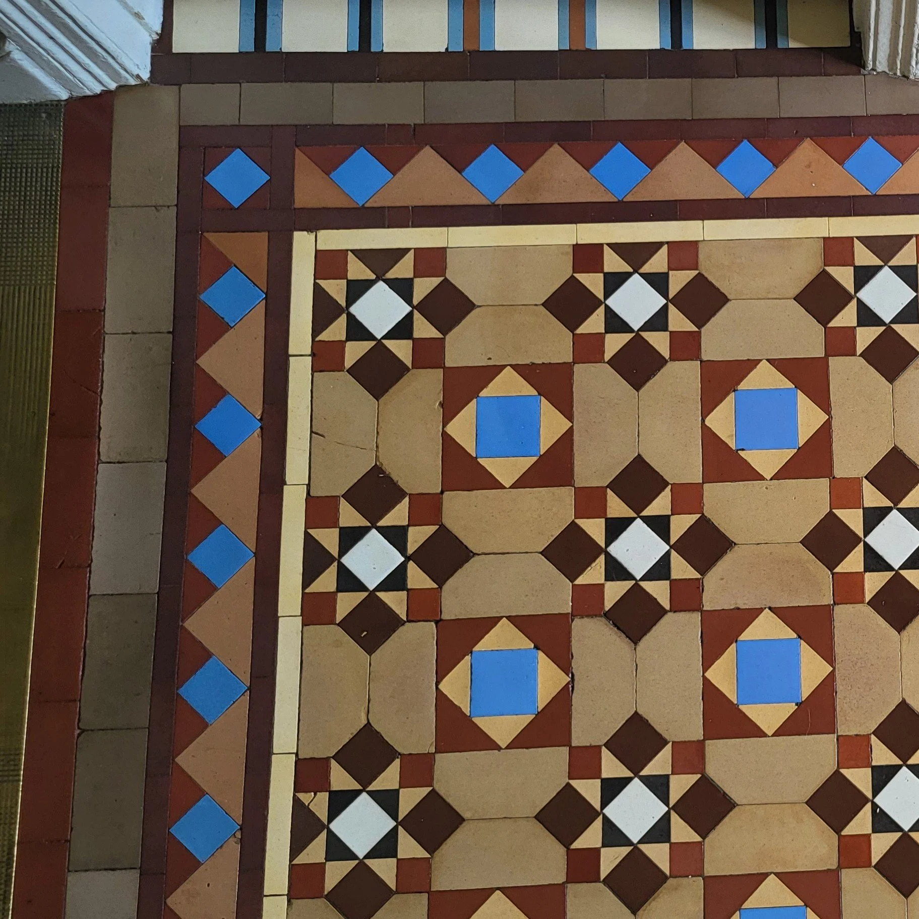 Beautiful original vintage hallway tiled all refurbed and featuring coffee, blue and orange accents
