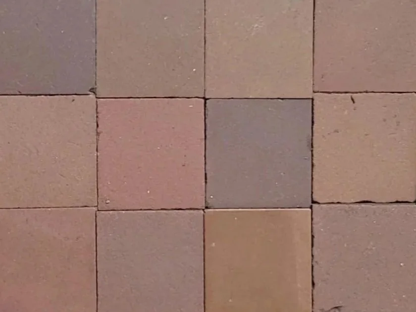 Close-up showing the variation in vintage tiles, all of these are classed as two inch brown victorian squares.