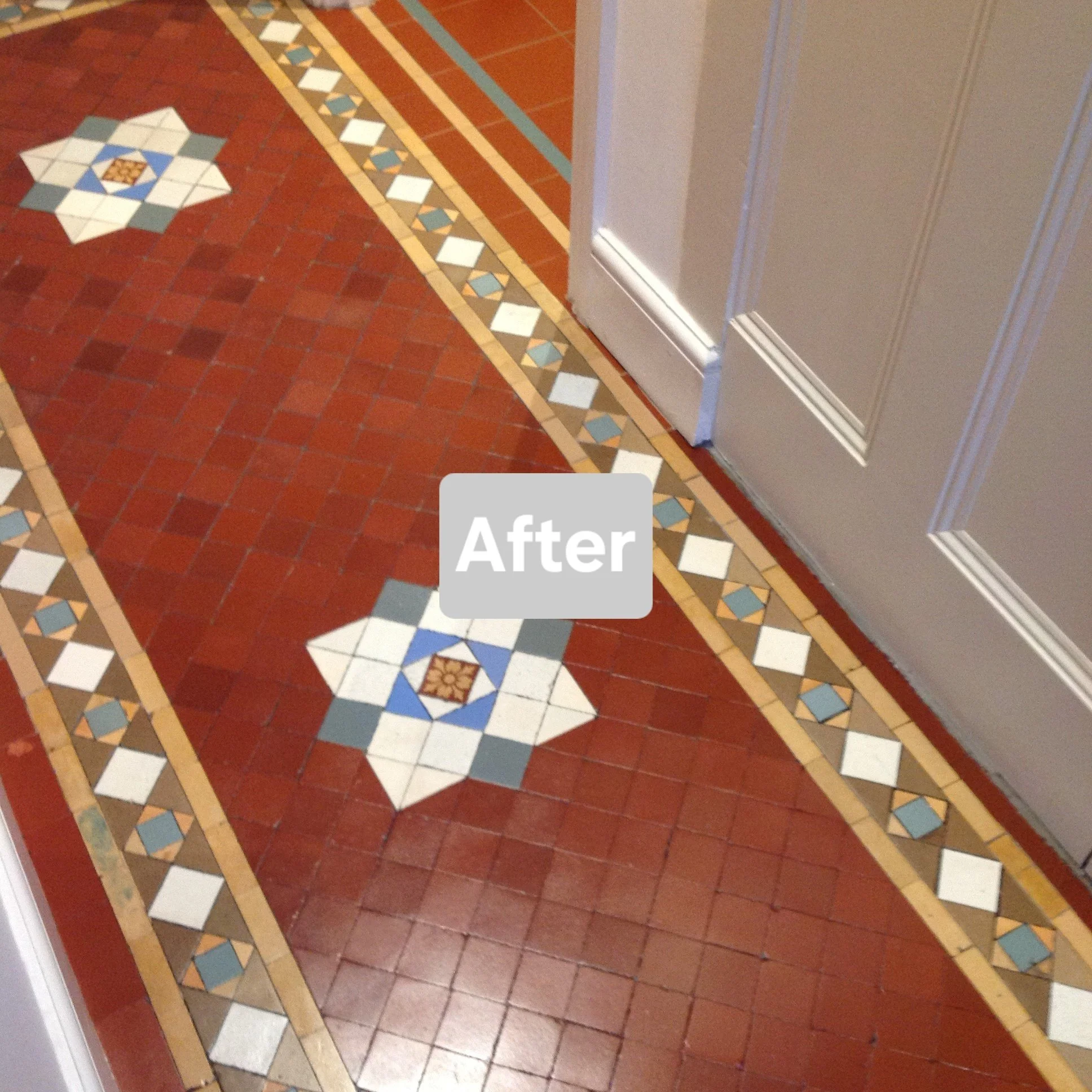 Decorative tiled floor next to a door with the word 'After' on it.