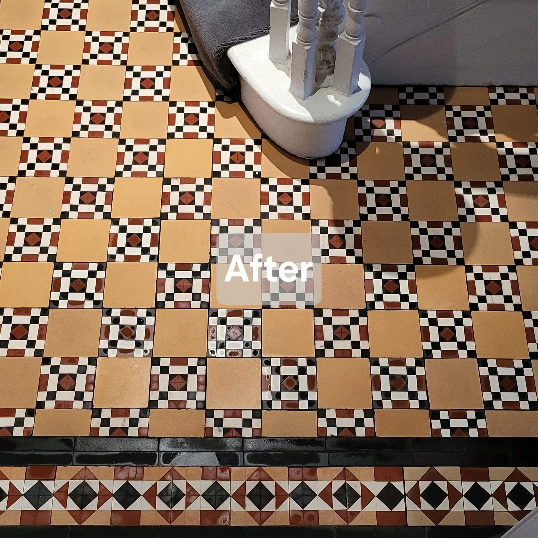 Poole Pottery chequerboard tiled hallway in bright yellow, black, red and white from the late 19th century