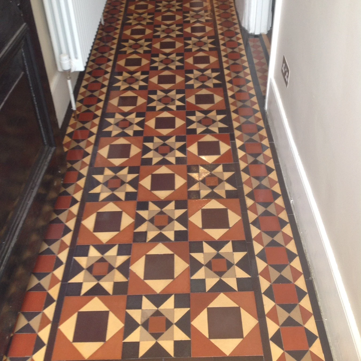 Vintage hallway in typical earthy colours of red, yellow, coffee and brown colours.