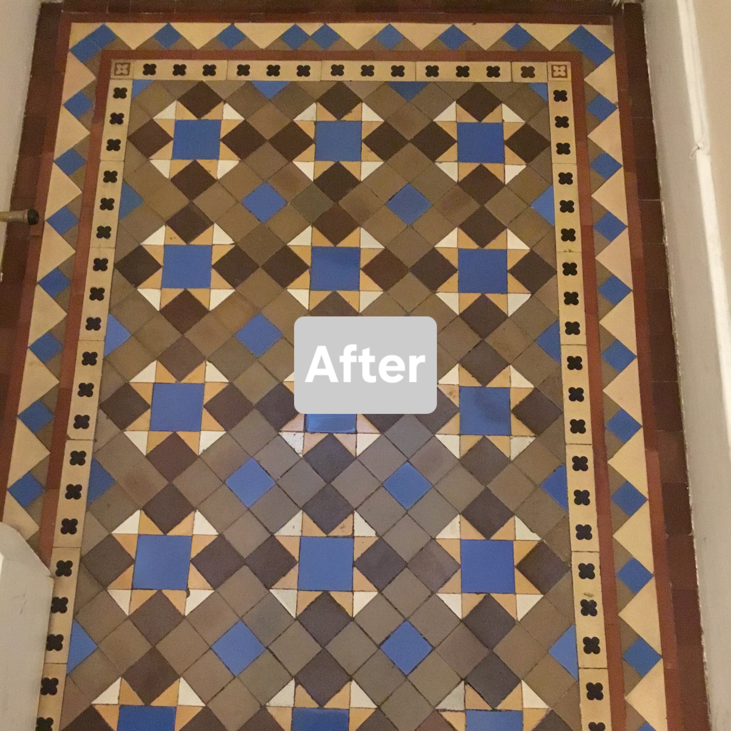 Geometric tiled hallway in coffee yellow and brown with a bright blue accent and black and buff encaustic border tile, with the word 'After' overlayed in the centre.