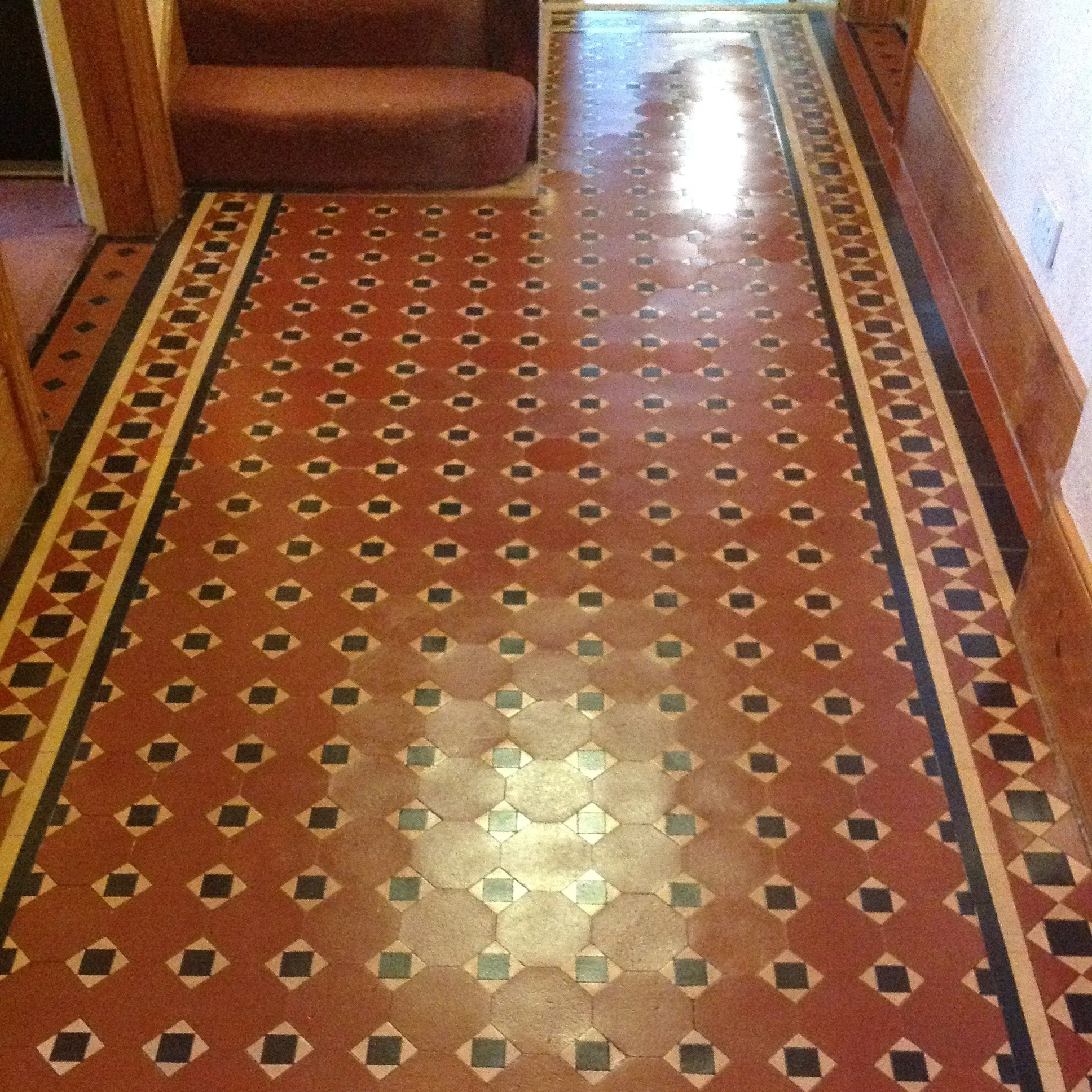 Mainly red, polished tiles in a typical Edwardian format in red, yellow and black.