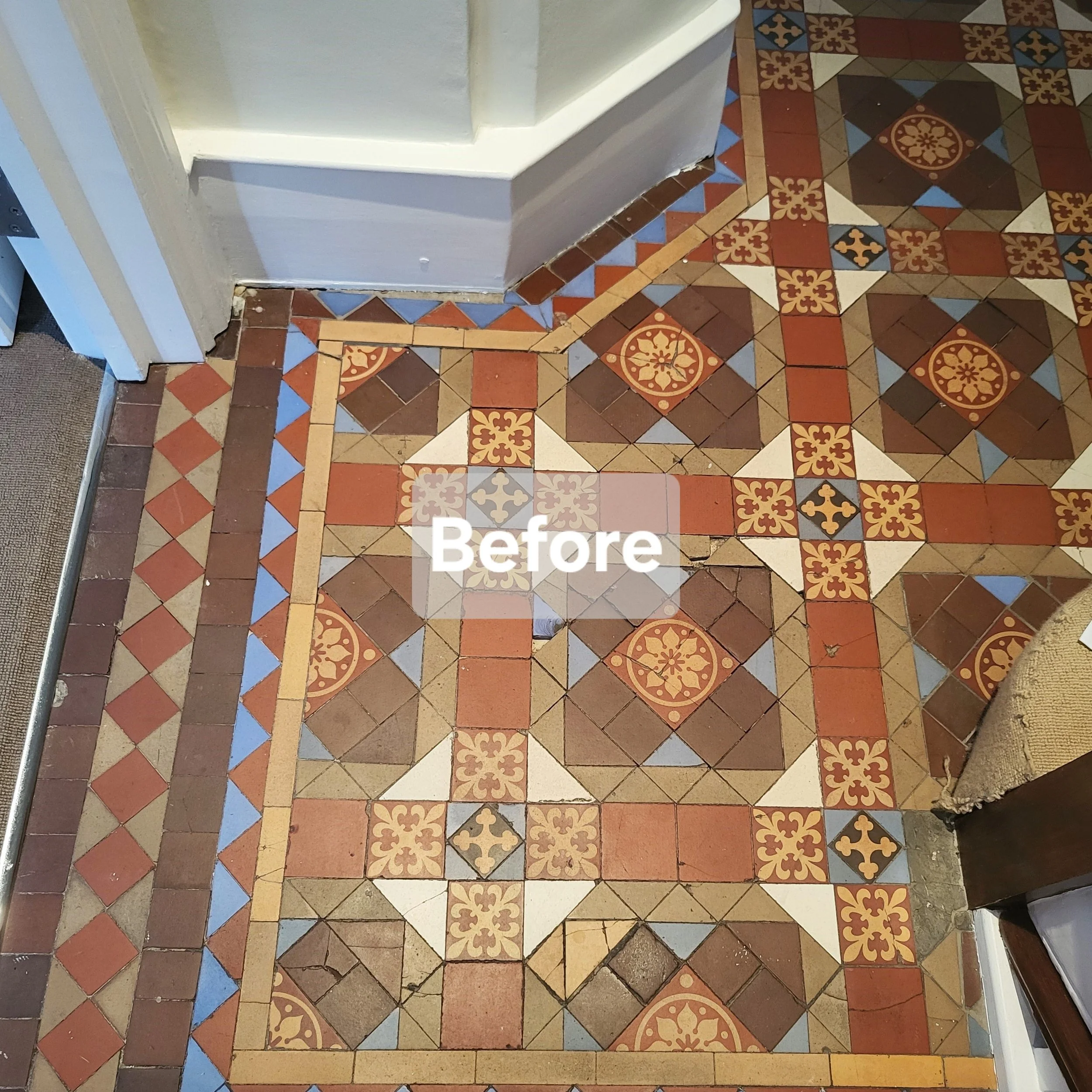 Close-up of a vintage, patterned tile floor with intricate geometric and floral designs in shades of brown, red, blue, and cream, partially covered by the word 'Before'.