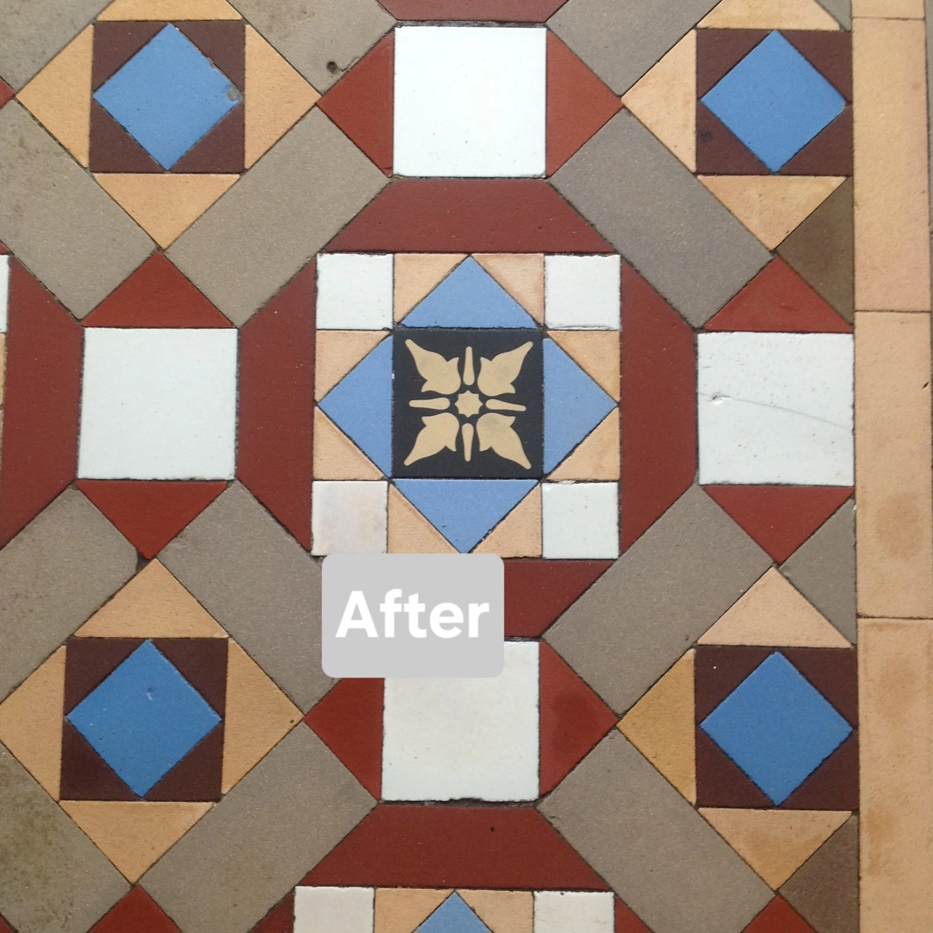 Close up of the same area as the previous photo showing clean tiles and,marked with a label that says "After."