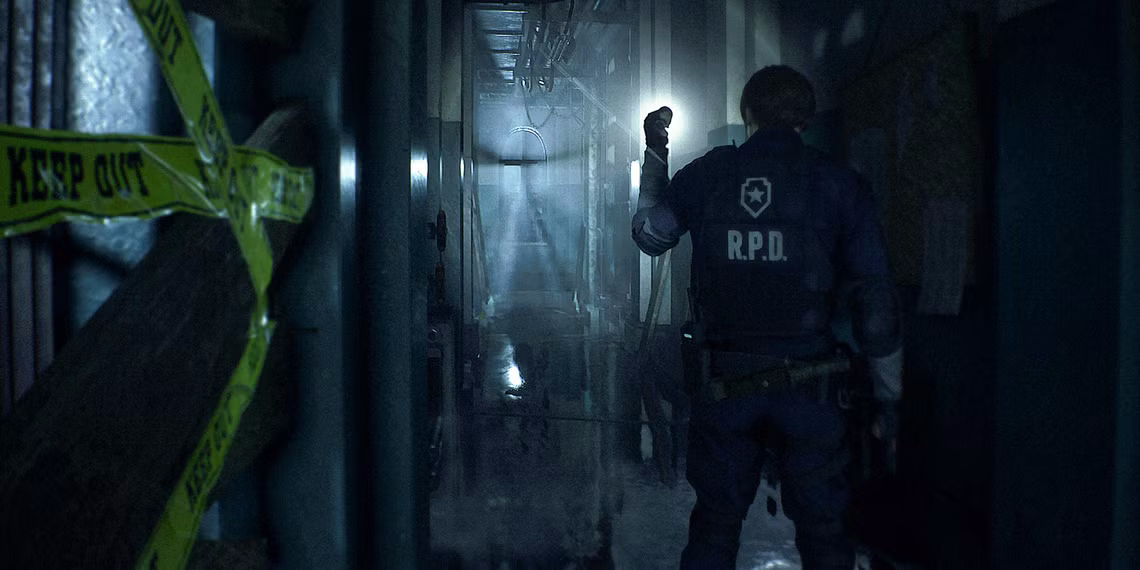 RE 2 Remake screenshot showing Leon standing in front of a long dark hallway of the RPD, branding a flashlight