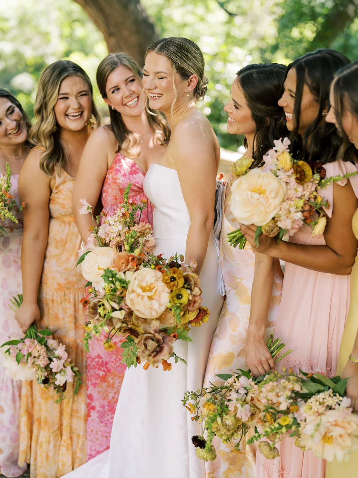 bride and bridesmaid with gold and taupe bouquets at Laguna Gloria Wedding
