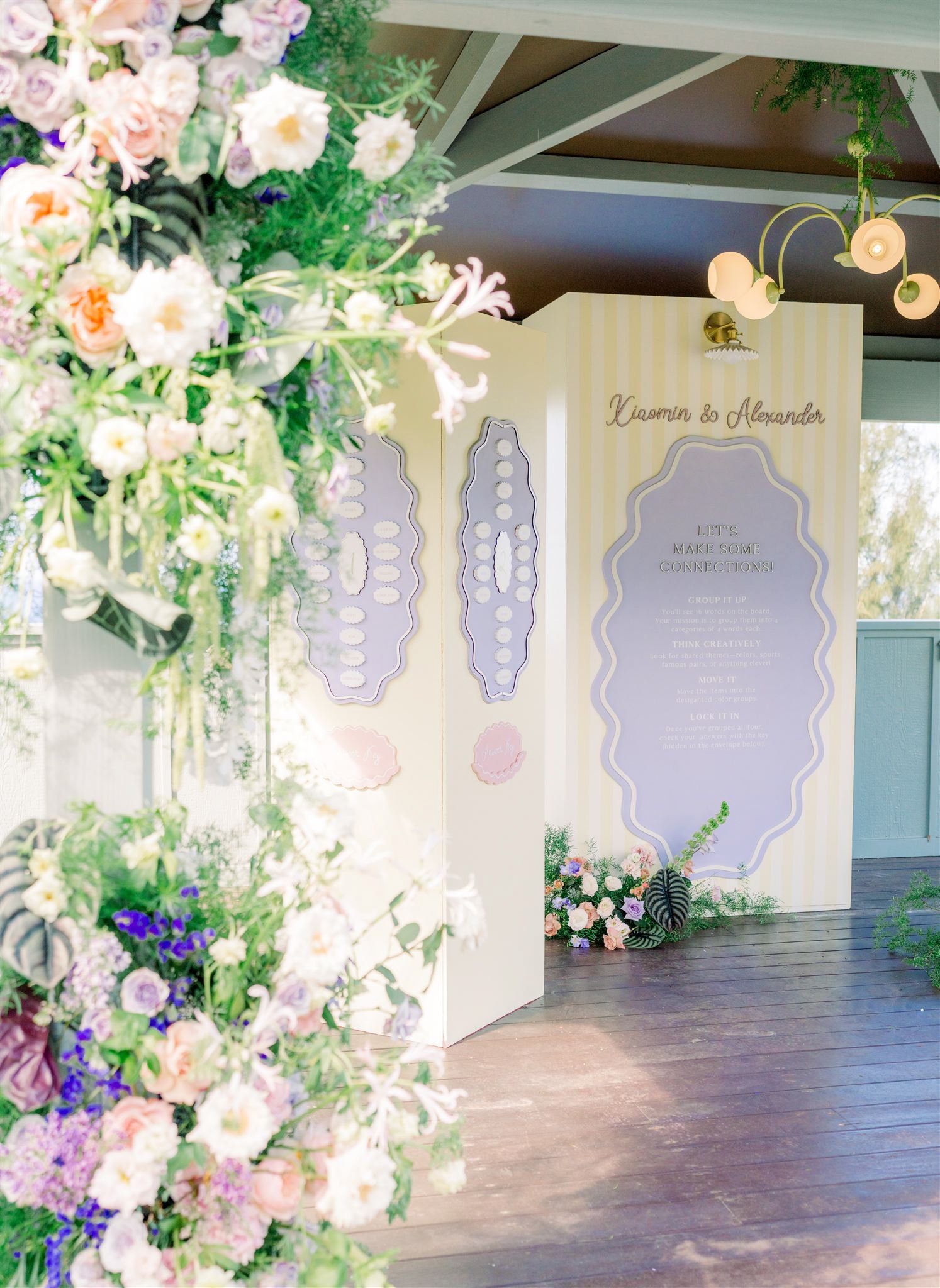 lush pastel and tropical flowers at a seating chart for Kauai wedding