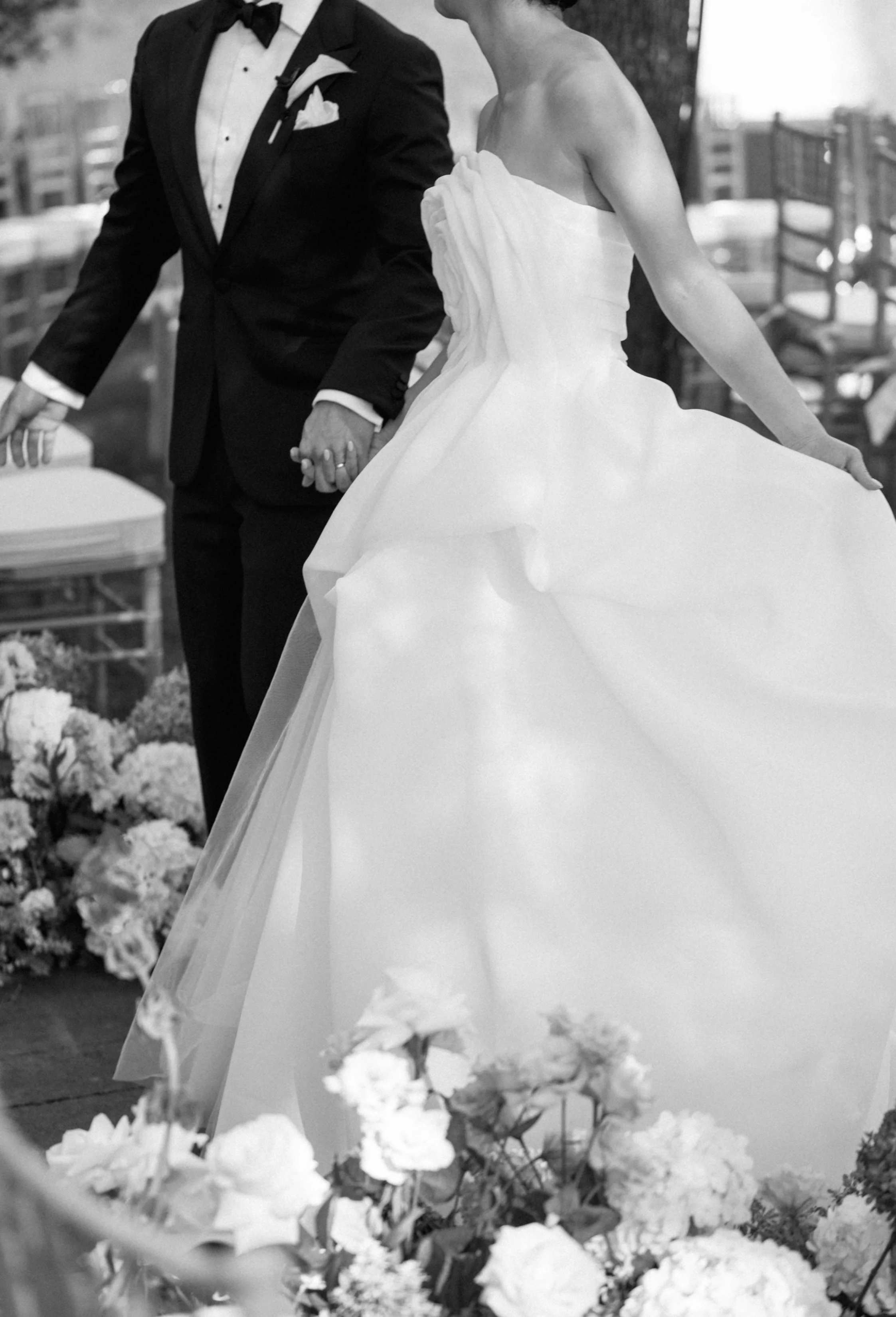 Bride and groom walking at ceremony aisle at Nasher Sculpture Garden