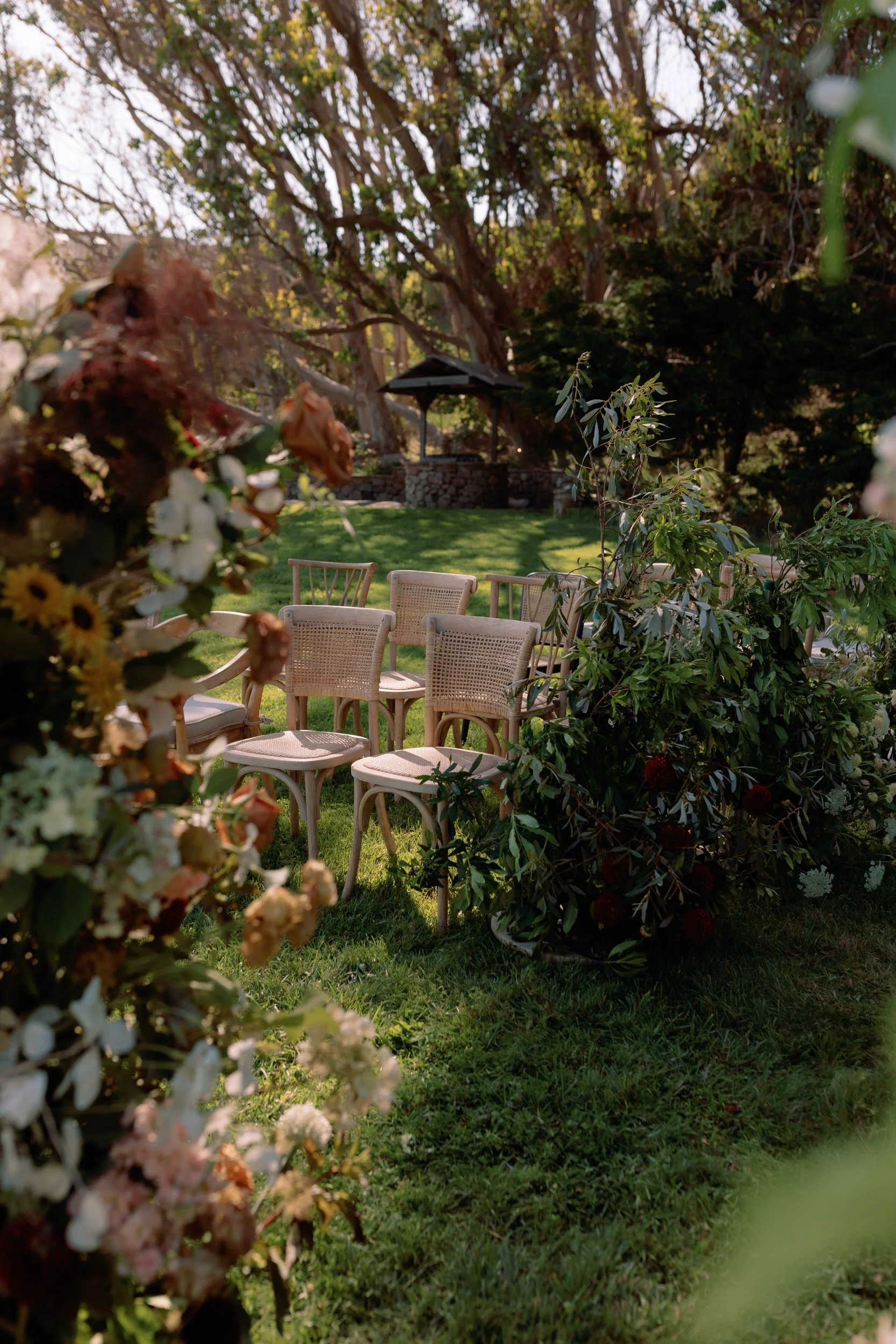 floral arch and greens at ceremony Timber Cove