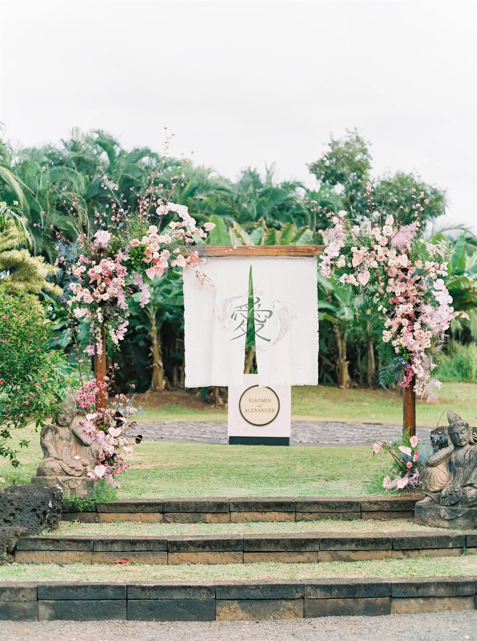 pink florals and orchids floral arch Kauai, Hawaii