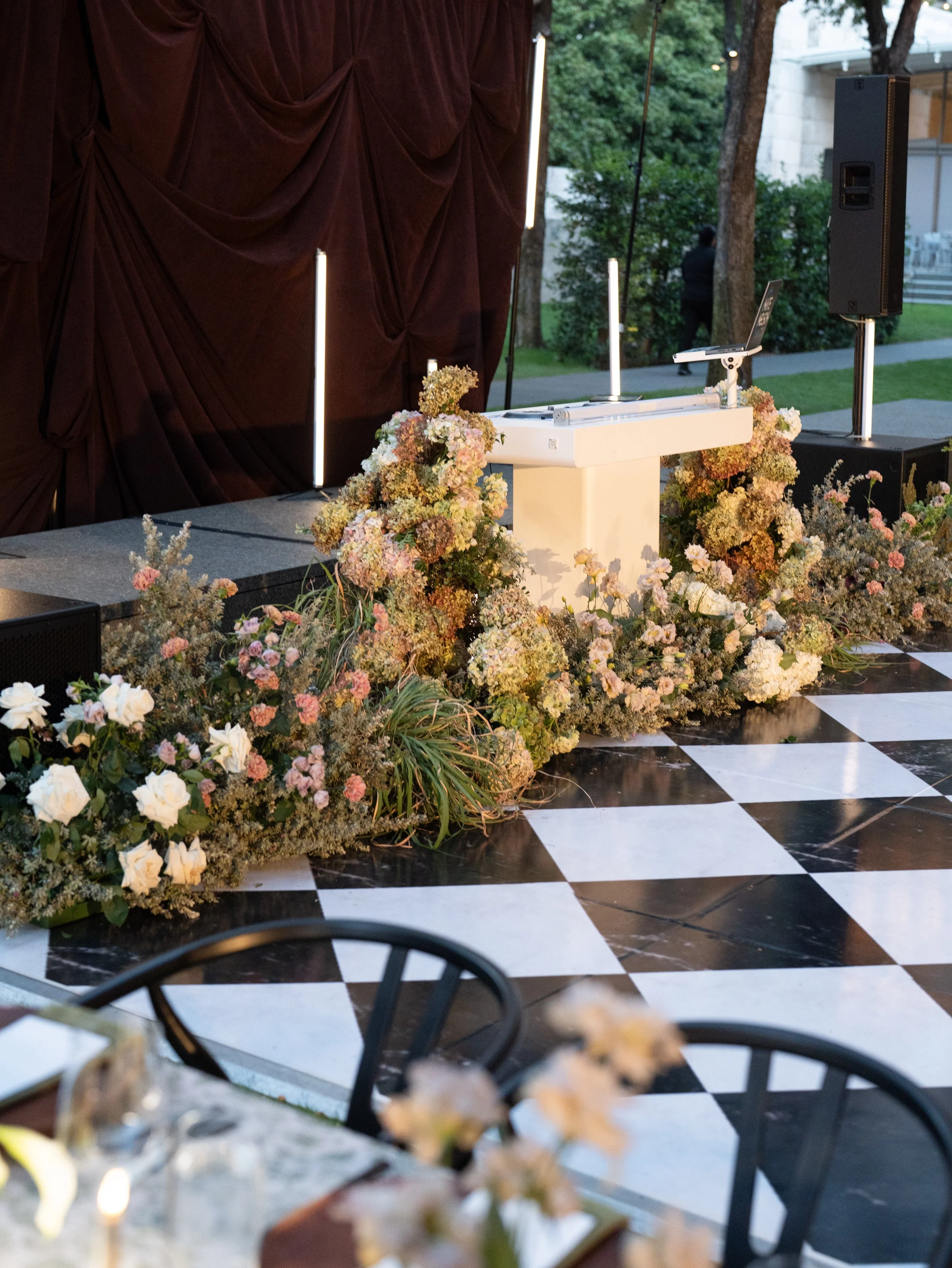 lush growing floral with grasses and hydrangea and sage for wedding reception dance floor