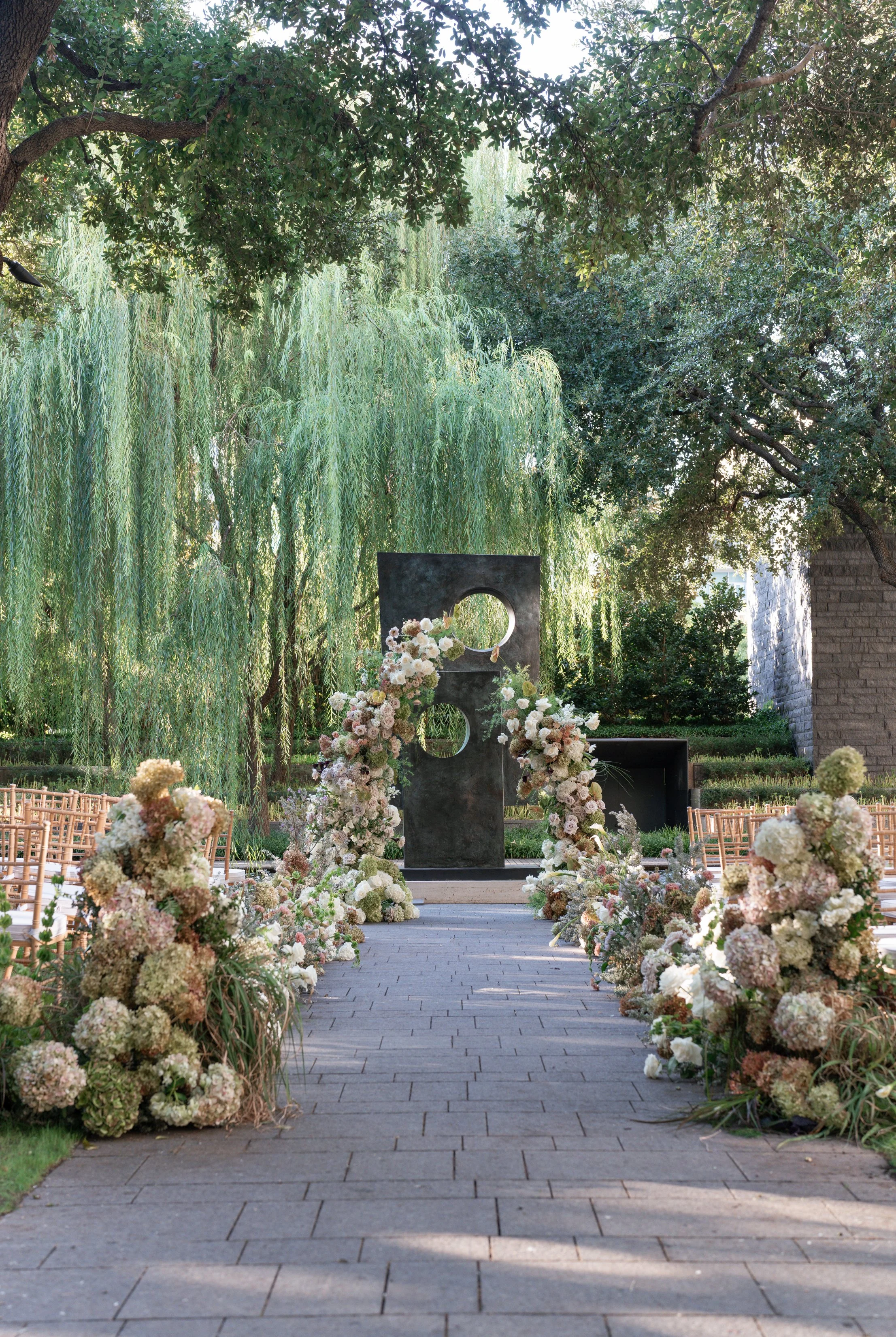 deconstructed lush arch with peegee hydrangeas at Nasher Sculpture Center