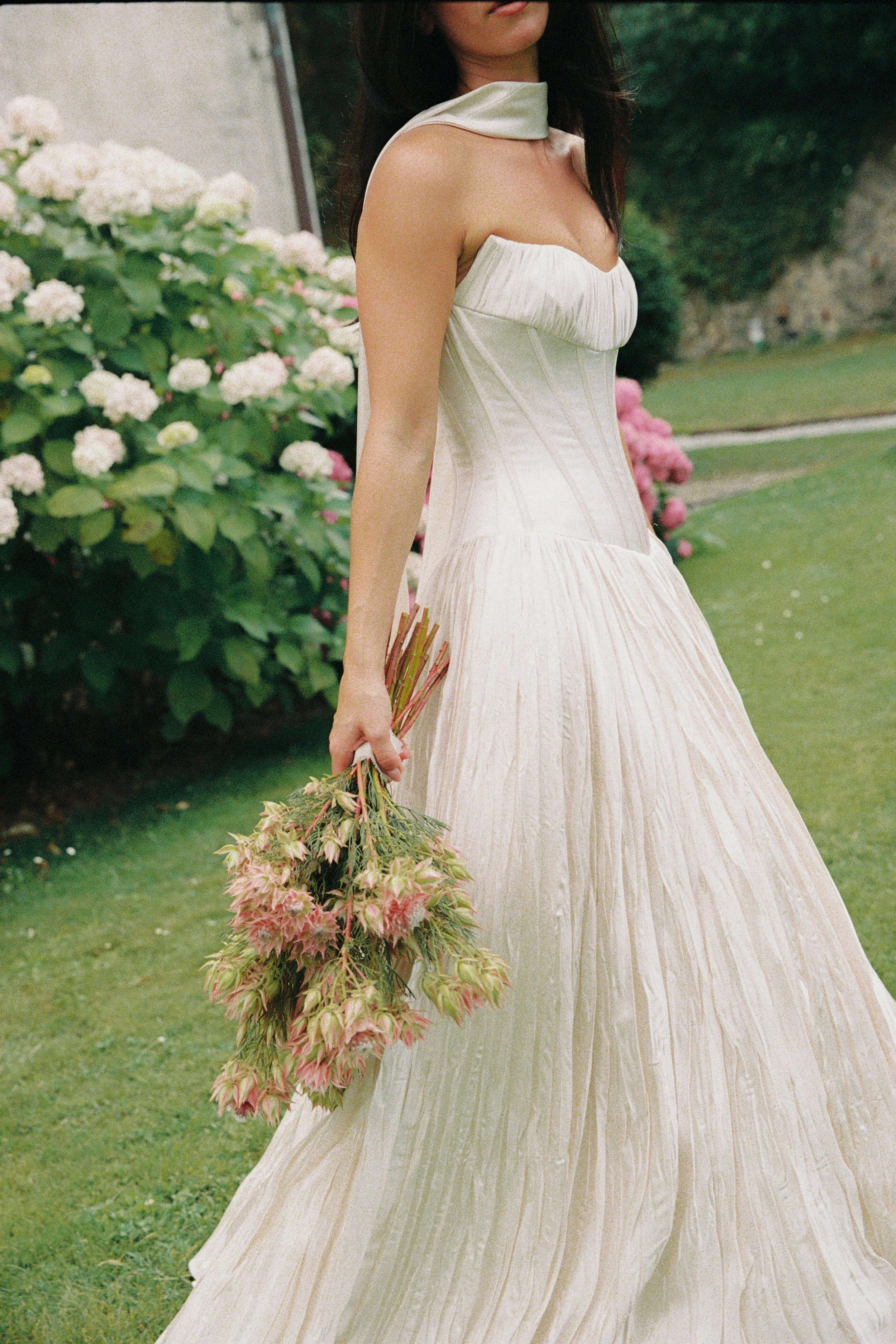 Bride holding a bouquet at Villa Buonvisi Tuscany