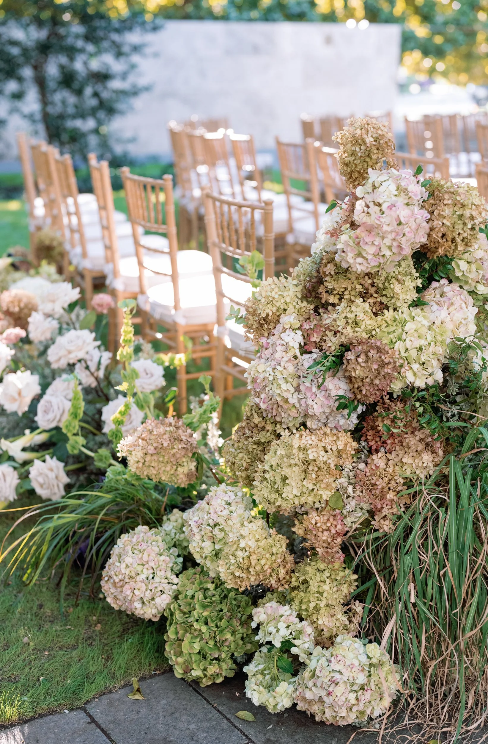 wedding ceremony aisle floral peegee hydrangeas at Nasher Sculpture Center in Dallas, Texas