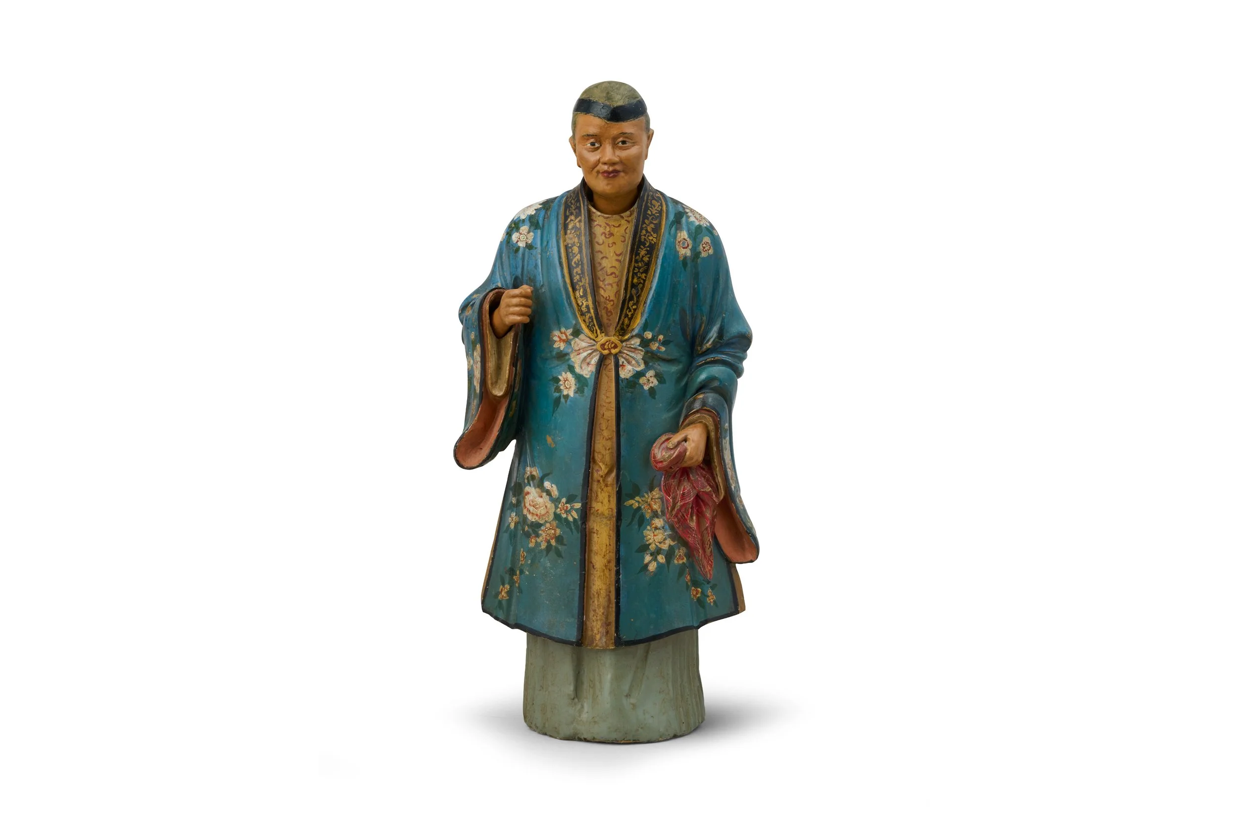 A Chinese unfired clay nodding-head figure of an old lady.