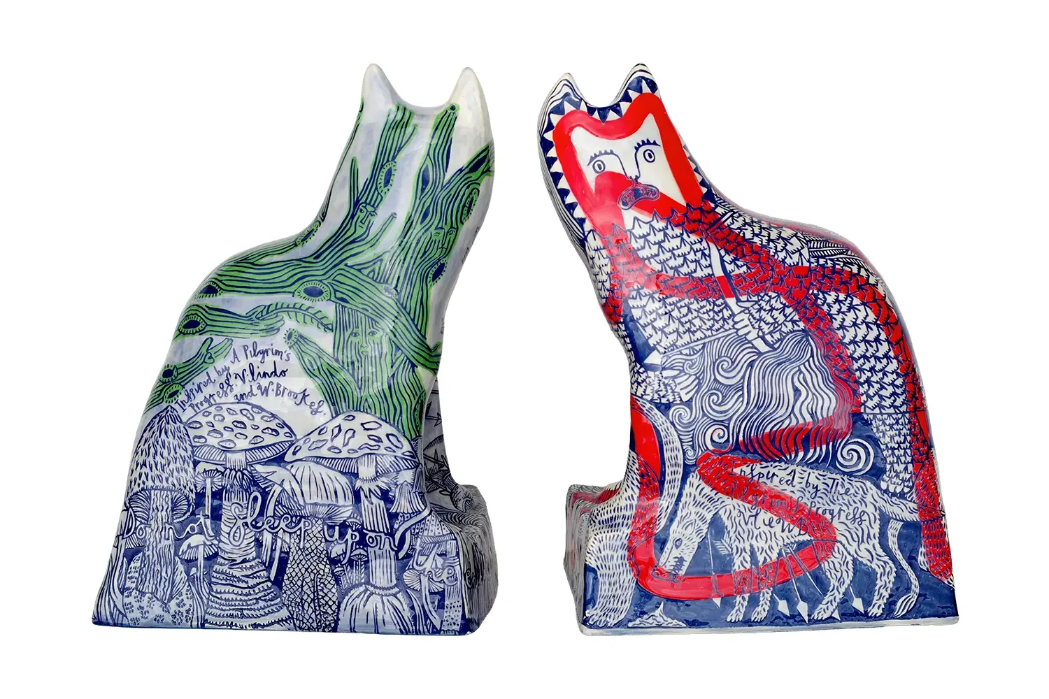 Ceramic sculptures of two stylised cats from behind.