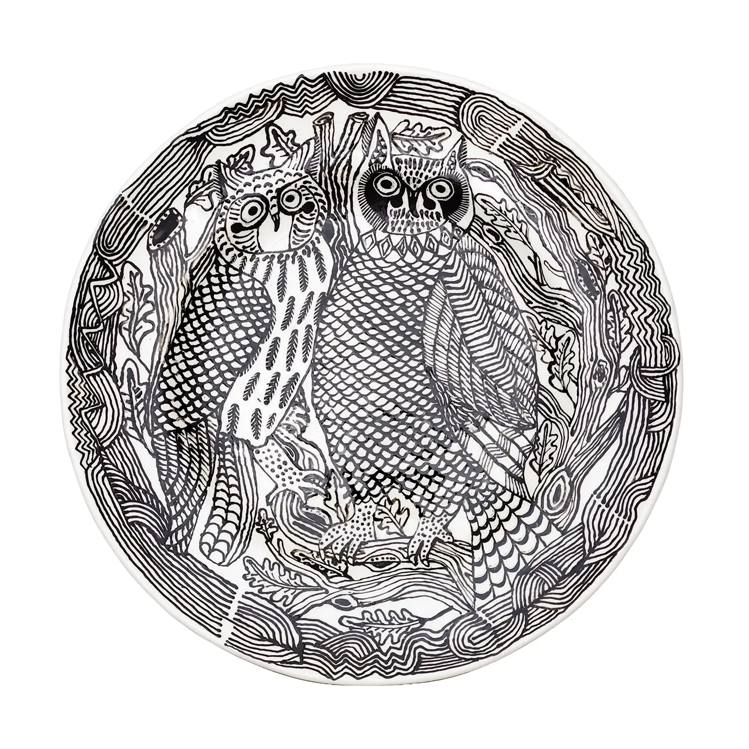 Black and white decorative plate featuring two owls sitting on a branch, surrounded by leaves and intricate patterns.