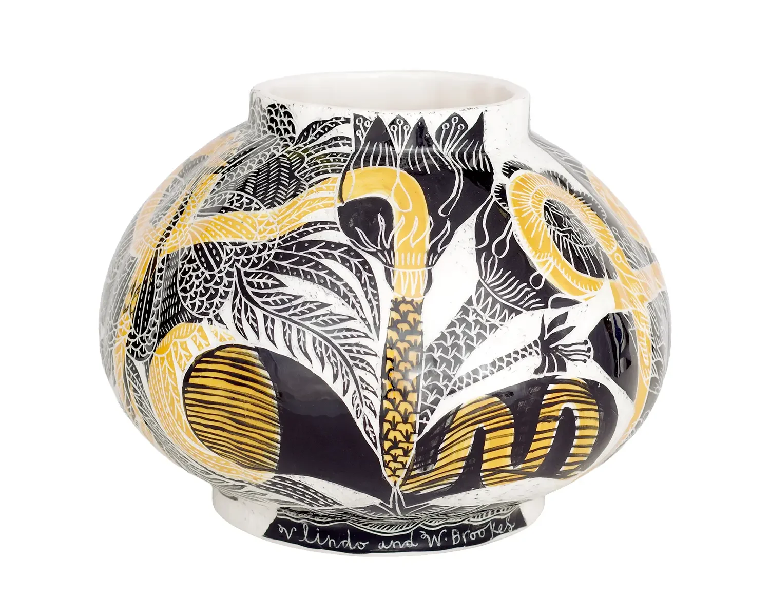 Decorative ceramic vase with black, white, and yellow tropical botanical patterns, including leaves and fruits.