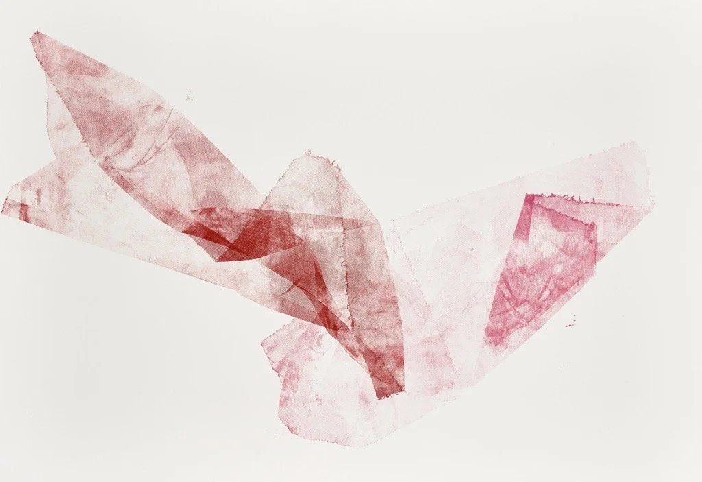 Abstract watercolor painting in shades of red and pink on a white background.