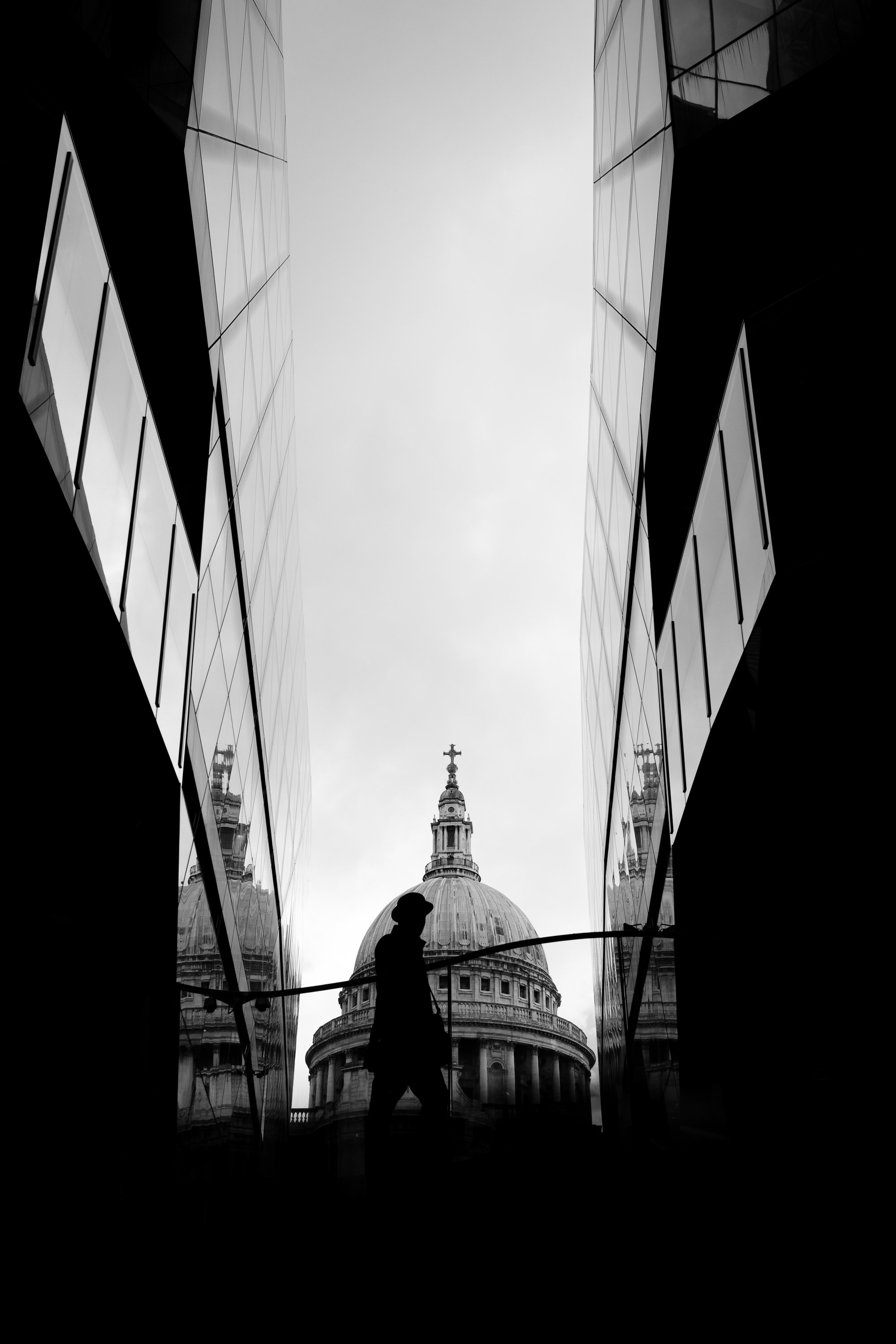 St Paul’s Cathedral framed between the modern glass walls of One New Change in the City of London.
