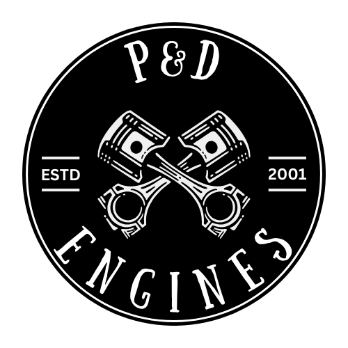 Black circular logo with white outline and text. Features two crossed pistons in the center. Text includes 'P & D', 'ESTD 2001', and 'ENGINES'.