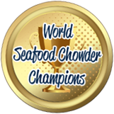 A gold medal with blue text reading 'World Seafood Chowder Champions'.