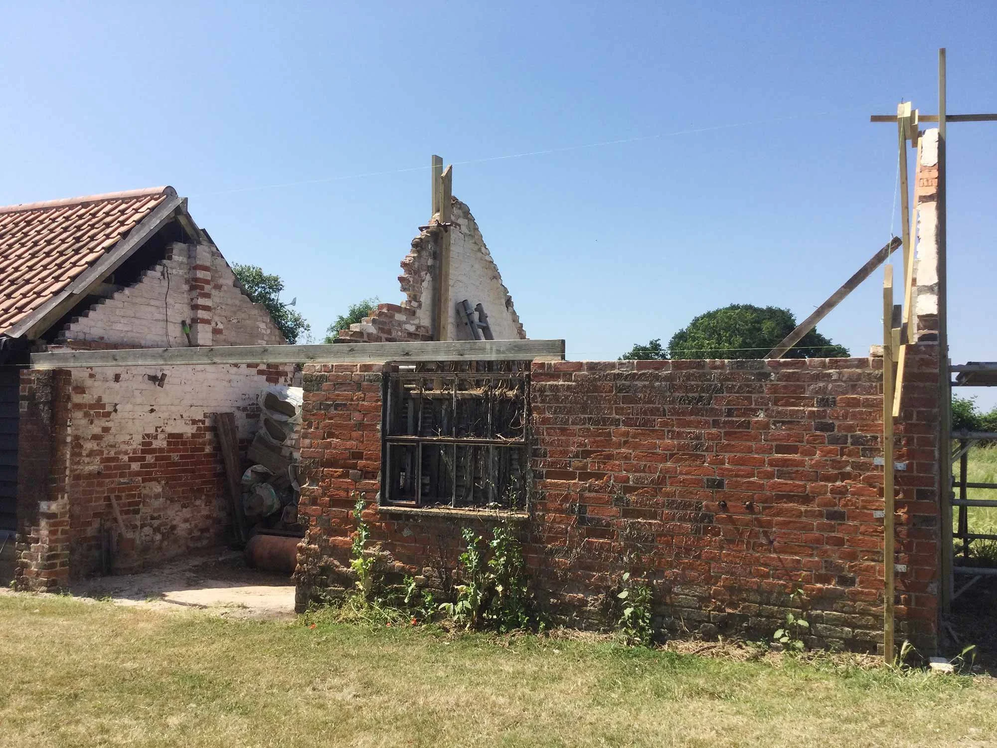Barn structure with roof removed during renovation.