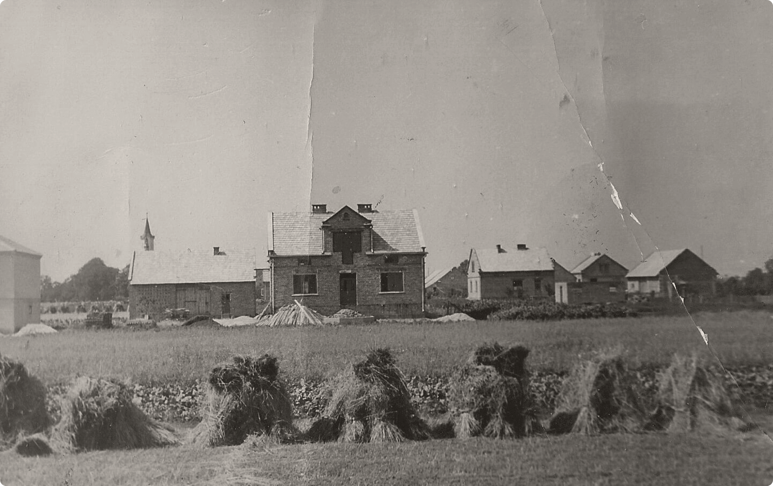 Black and white photo of a home in Poland mid-construction being built — studio domka — personal branding coach