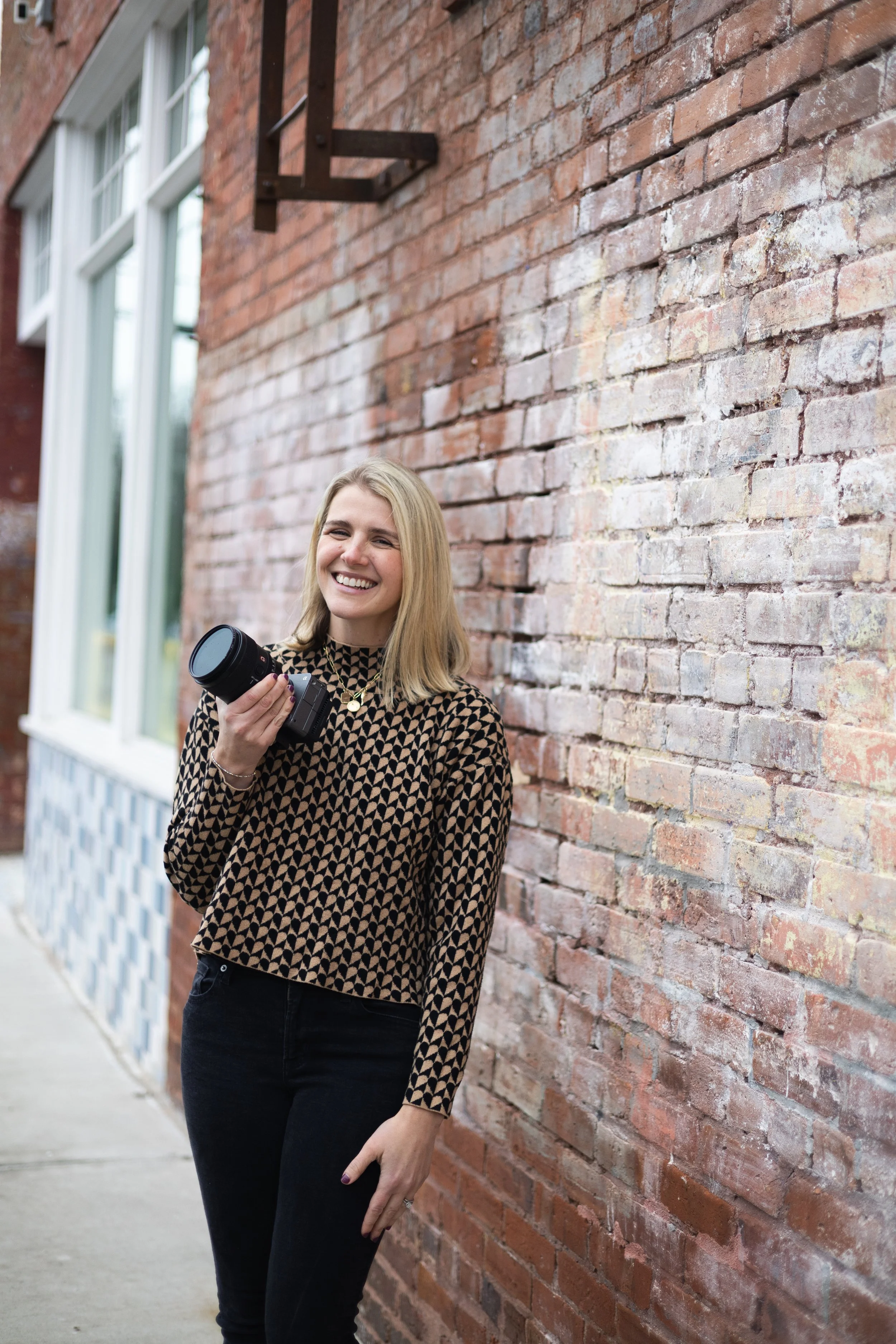 female videographer with camera in Charlotte, North Carolina