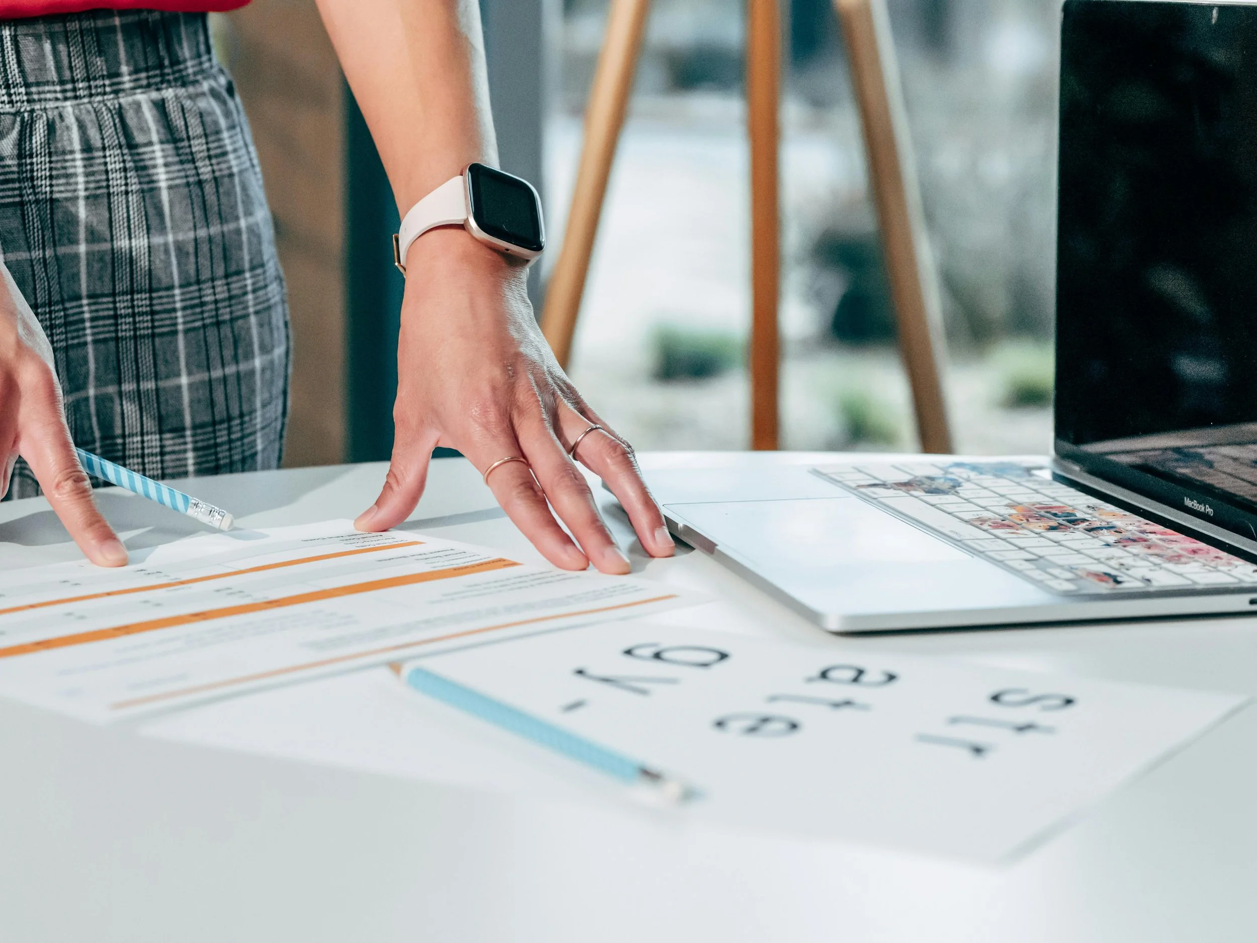 Workspace with documents and laptop representing structured preparation and conflict strategy planning.