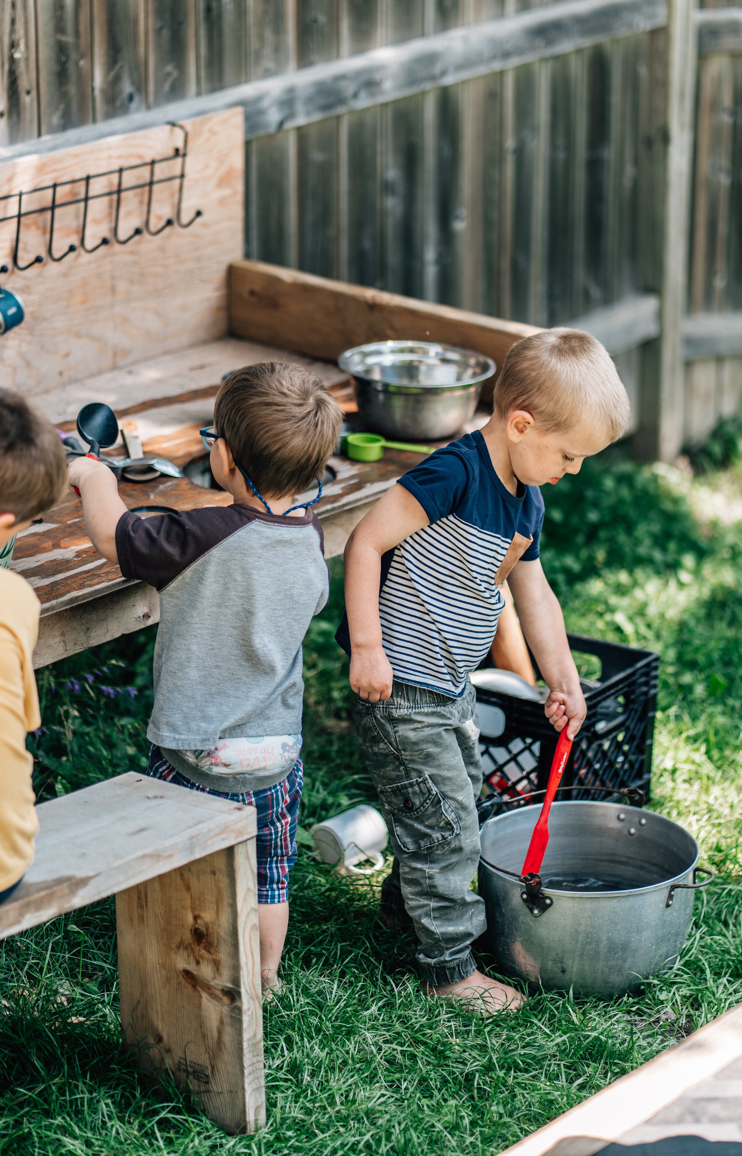 Two children make snail soup at the Belleville Outdoor Preschool