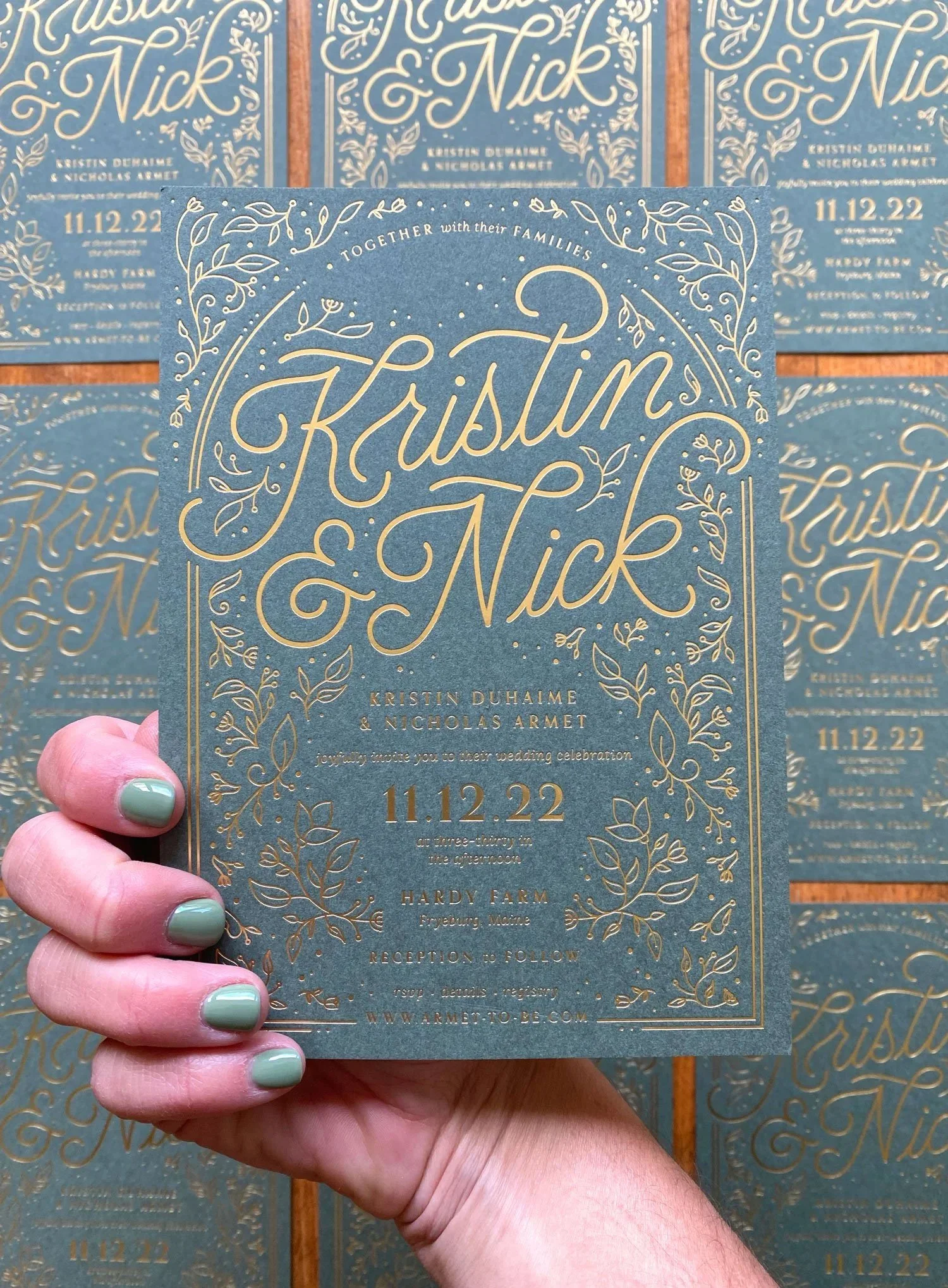 Wedding invitation card with gold script and decorative borders, featuring names Kristina and Nick for their wedding on November 12th, 2022 at Hardy Farm.