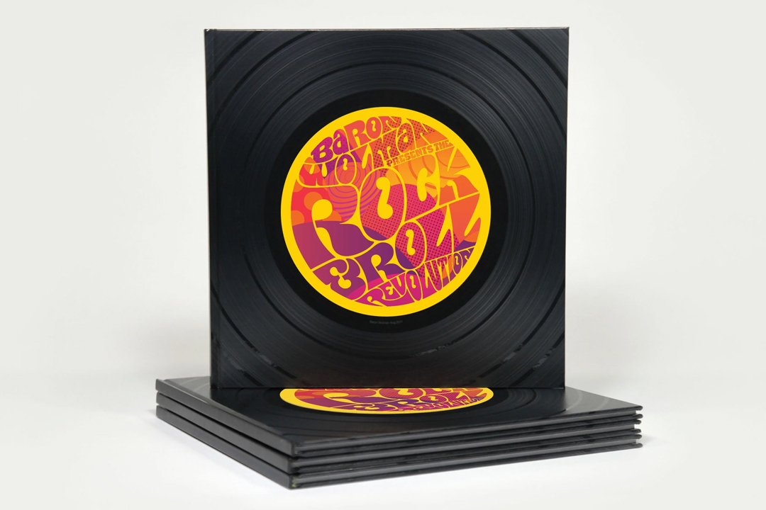Stack of black vinyl records with a colorful, psychedelic-designed label in the center that reads "The Fruit of the Revolution".