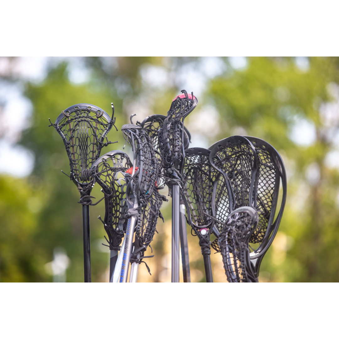 Lacrosse sticks held together in a huddle