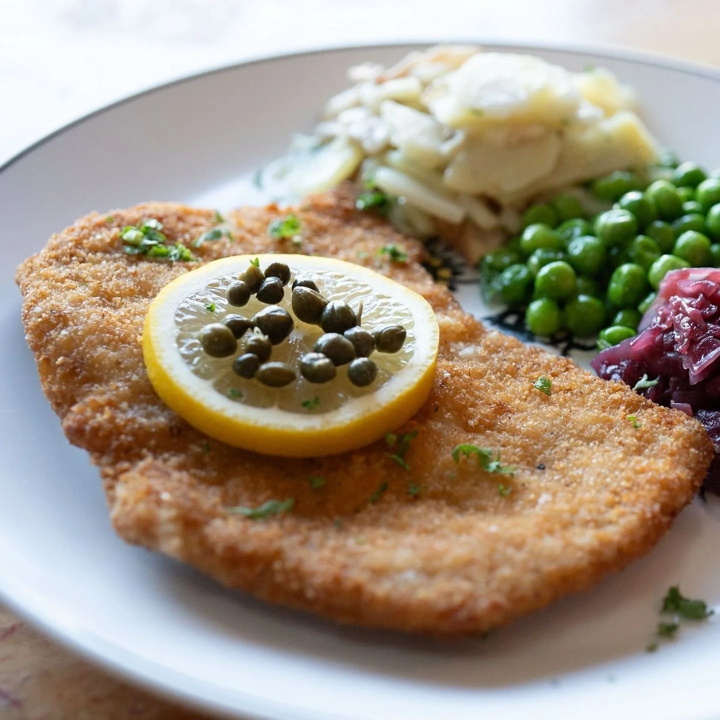 WUNDERBAR SCHNITZEL 🍽️✨

Authentic Wiener Schnitzel, the way it's meant to be. Guten Appetit! 🇩🇪

Fried pork cutlet pounded thin, breaded in-house, and pan-fried in clarified butter. Served with braised red cabbage 🥬, German potato salad 🥔, and 