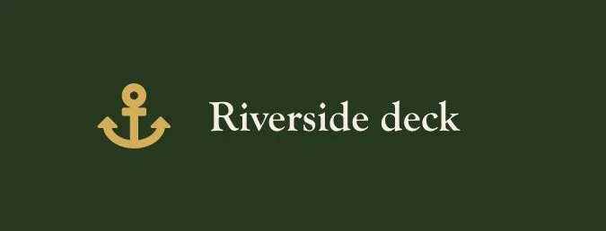 Green background with a gold anchor icon and white text that reads 'Riverside deck'.