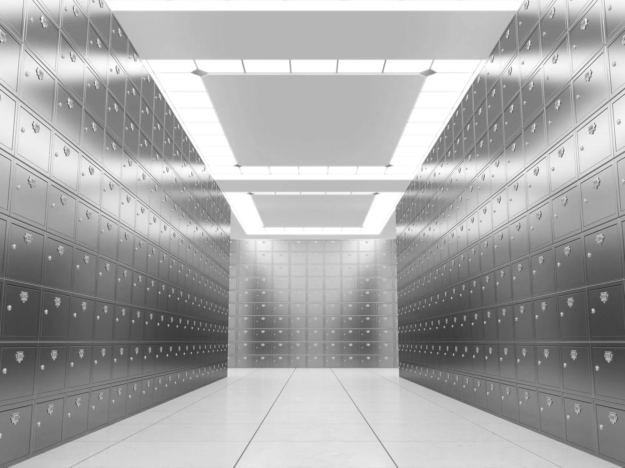 A hallway lined with metallic lockers with small combination locks.